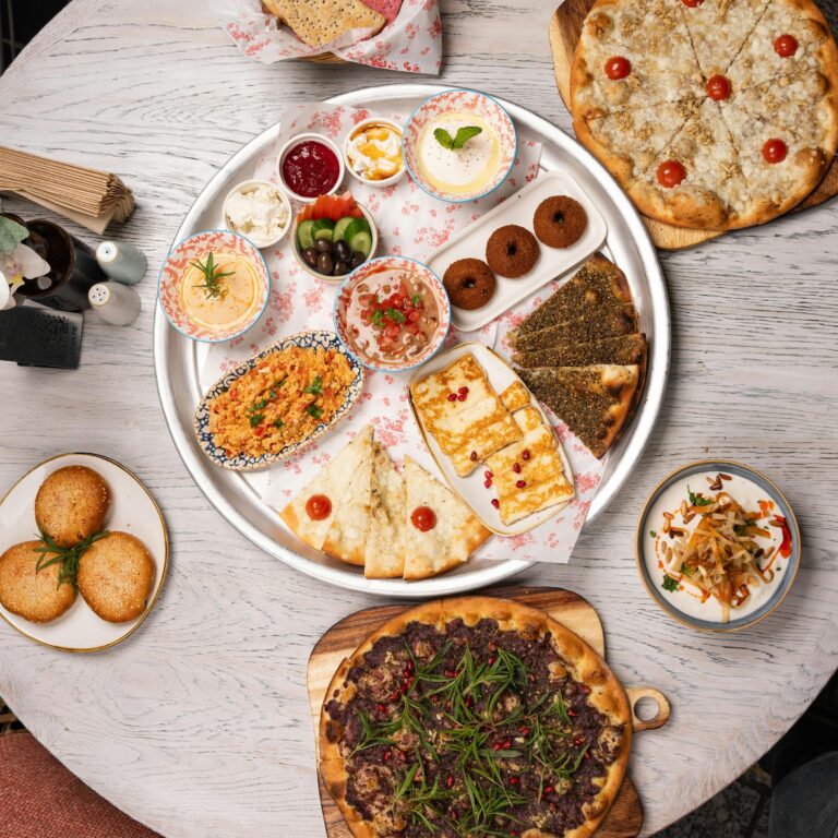 Vibrant Middle Eastern mezze platter showcasing a variety of delicious appetizers and flatbreads.